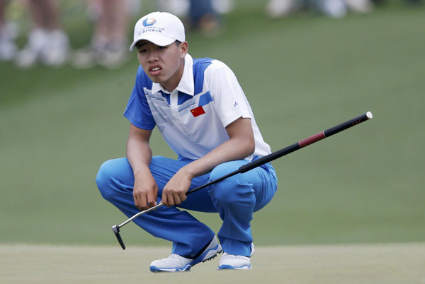 Guan fires 73 in historic Masters debut